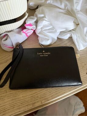 kate spade black leather wristlet with gold logo